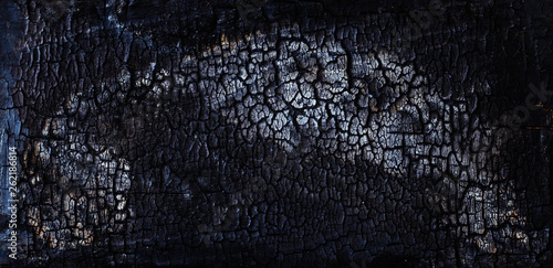 Bilde på lerret Black soot on burned wooden wall