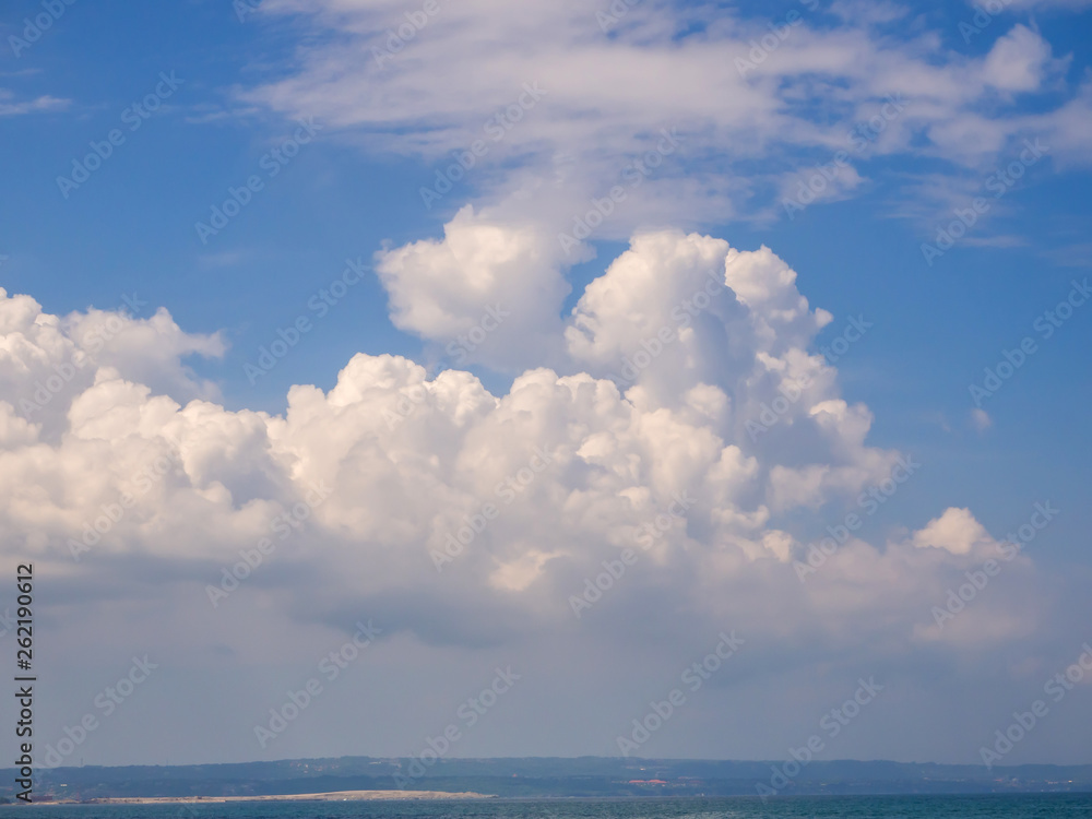 Beautiful, cumulus clouds in the blue sky