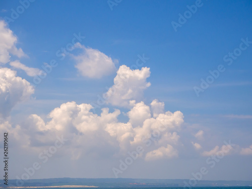 Beautiful, cumulus clouds in the blue sky