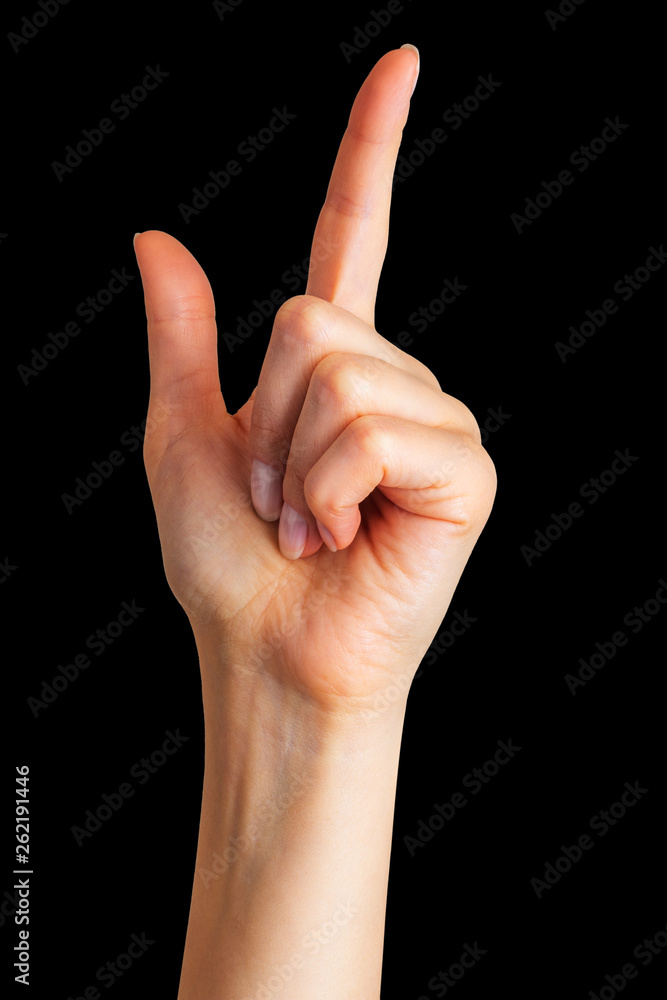 Woman hand with the index finger pointing up Woman hand with the index finger pointing up