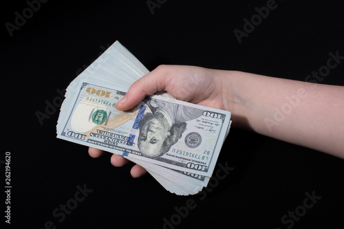 Hand holding American dollar isolated on white background