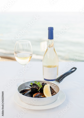 Dish from mussels against the background of the sea