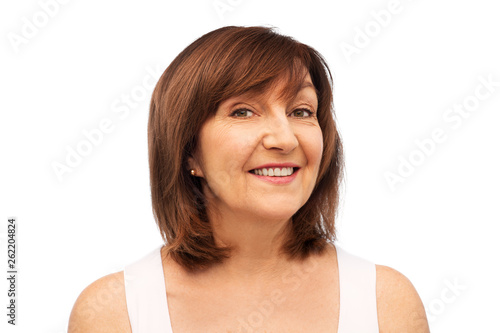 beauty and old people concept - portrait of smiling senior woman over white background