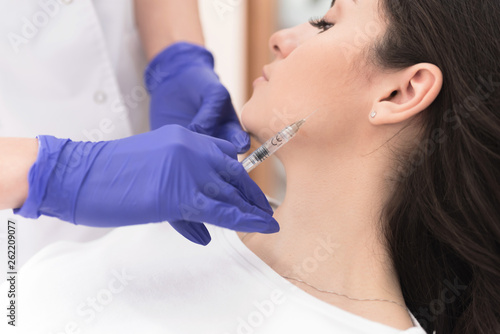 Woman having corrective aesthetic procedure