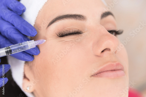 Woman having corrective aesthetic procedure