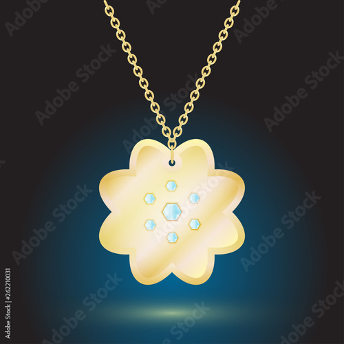 gold pendant jewelry on dark background with backlight.