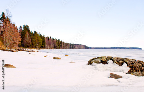 Coastline of Lake Onega from the opposite side of the city in spring