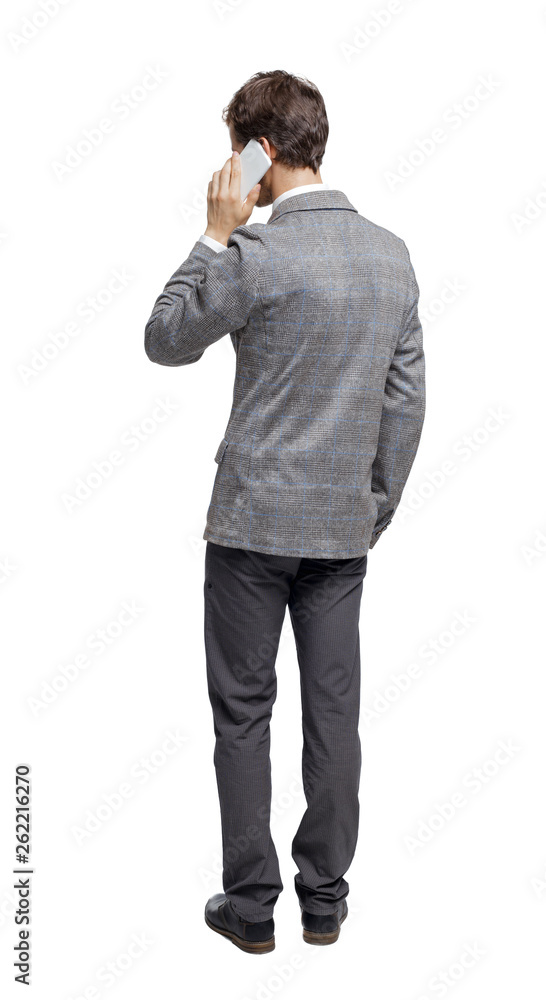 back view of business man in suit talking on mobile phone. back view of business man in suit talking on mobile phone.