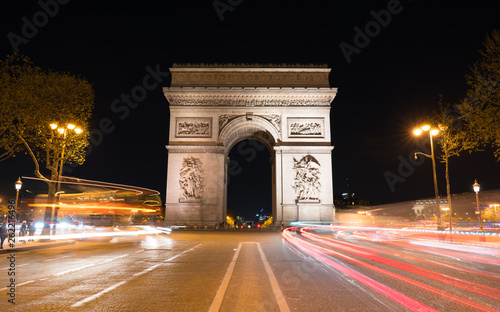 The Arc de Triomphe at Night. It is one of the most famous monuments in Paris, standing at the western end of the Champs-Elyseees. © bigguns