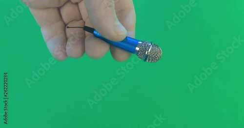 Reporter with microphone interviews goldfish. Conceptual footage, more options in my portfolio photo