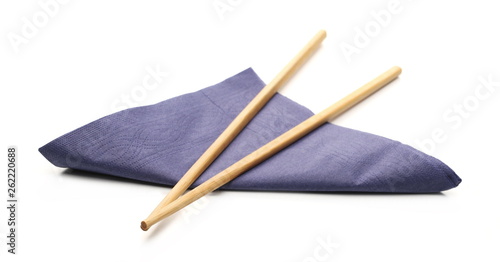 Paper napkins with chopsticks isolated on white background