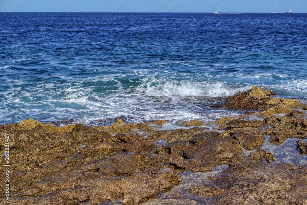 Sea stones rocks washed by sea in Bugibba, Malta
