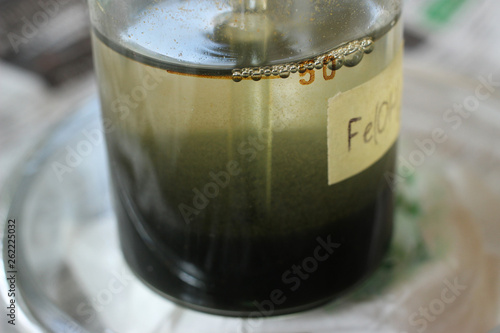 Vászonkép A turbid precipitate of iron hydroxide is settle at the bottom of the beaker