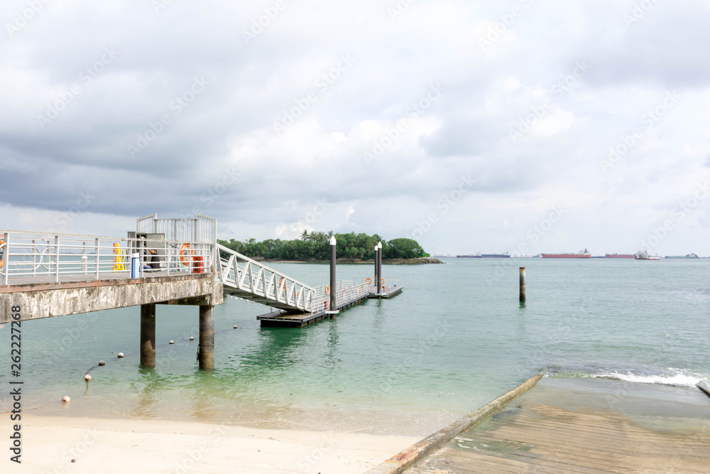 Obraz premium Siloso Beach Sentosa is the most famous white beach in Singapore. Siloso Beach Sentosa, Singapore, March 15 2019