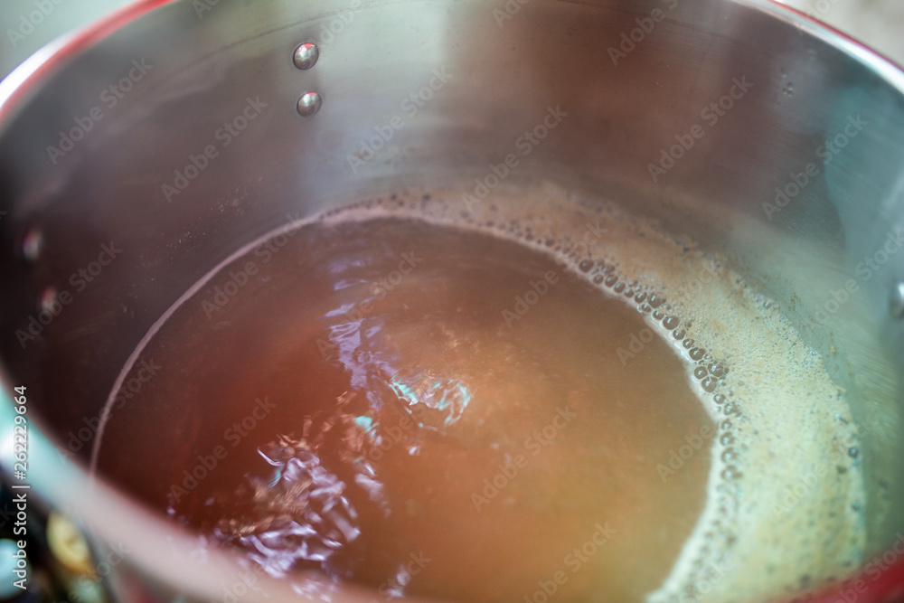 Beer wort starting to boil, Wort for Home Brew Wheat Beer. Beer wort starting to boil, Wort for Home Brew Wheat Beer.