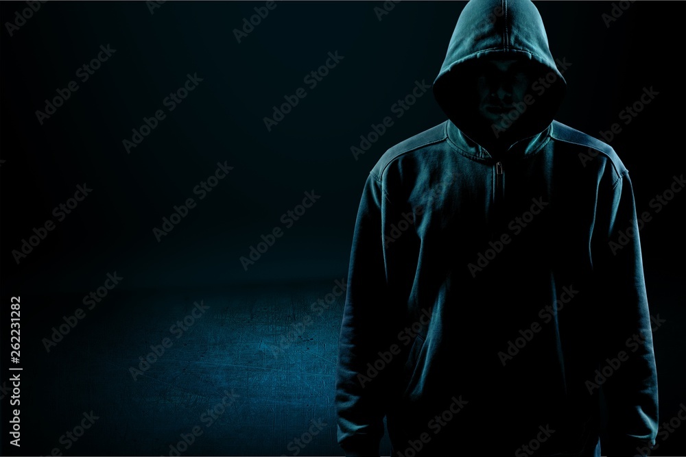 Dark unrecognisable man in hoodie on background Stock Photo | Adobe Stock