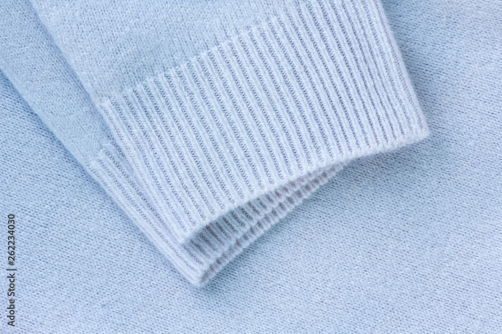 clothing detail of soft blue cashmere fabric clothing detail of soft blue cashmere fabric