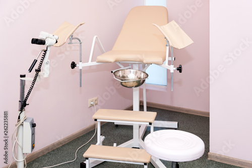 Gynecological cabinet with chair and other medical equipment in modern clinic. Equipment medicine, medical furniture, hospital, genicology, women's consultation photo