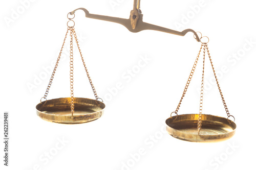 Justice law judge brass balance scales on white background. Close up image