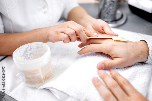 Manicures as a part of everyone   s regular grooming routine  man hands treatment