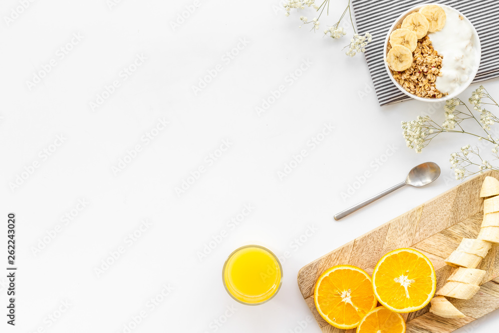 food for healthy breakfast with granola and fresh orange juice on bright white background top view mock up food for healthy breakfast with granola and fresh orange juice on bright white background top view mock up