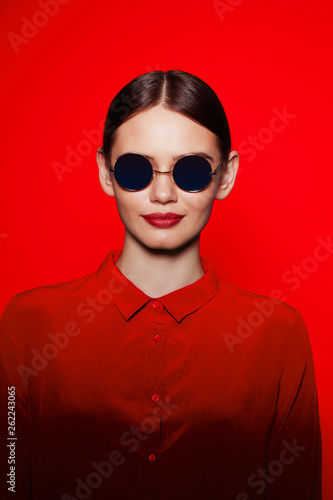 fashion model in sunglasses, beautiful young woman.