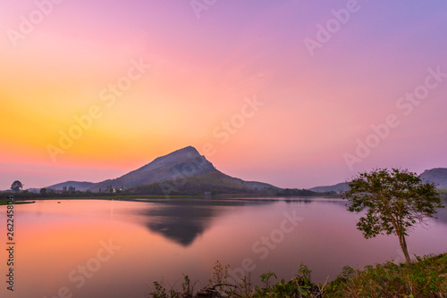 Mountains reflecting water before sunrise (Lam Isu Reservoir) Kanchanaburi, Thailand