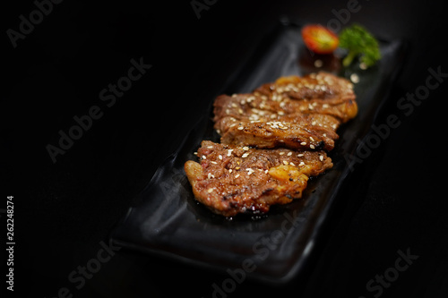 Japanese food  Stirred beef with sauce served with Japanese cooked rice on table. Clean food concept. Toned image. Selective focus and free space for text.