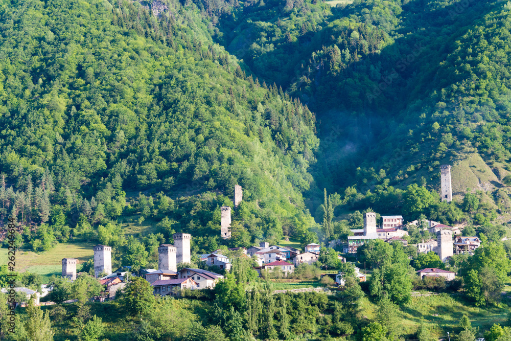 Mestia, Georgia - Jun 23 2018: Ancient towers with Mountain village. a famous landscape in Mestia, Samegrelo-Zemo Svaneti, Georgia.