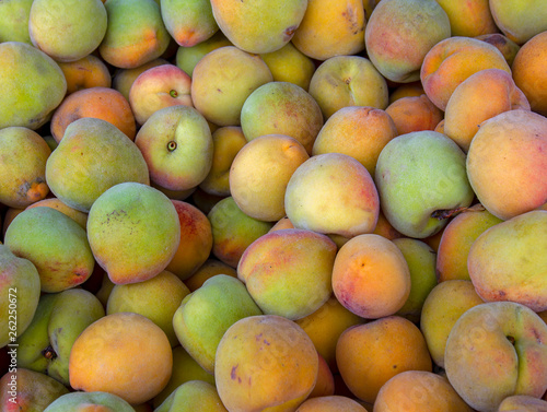 A heap of peaches photographed at the traditional local market of the colonial town of Villa de Leyva  in the Andean mountains of central Colombia.