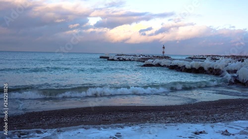 Waves on a beach after an ice storm. photo