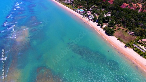 Aerial view of Arraial d’Ajuda Beach, Porto Seguro, Bahia, Brazil. Beauty landscape with several palm trees. Travel destination. Vacation travel. Tropical travel.
