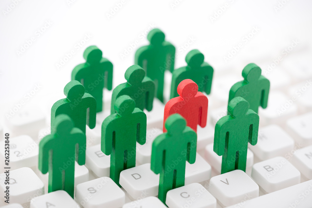 Unique person in the crowd on computer keyboard Unique person in the crowd on computer keyboard