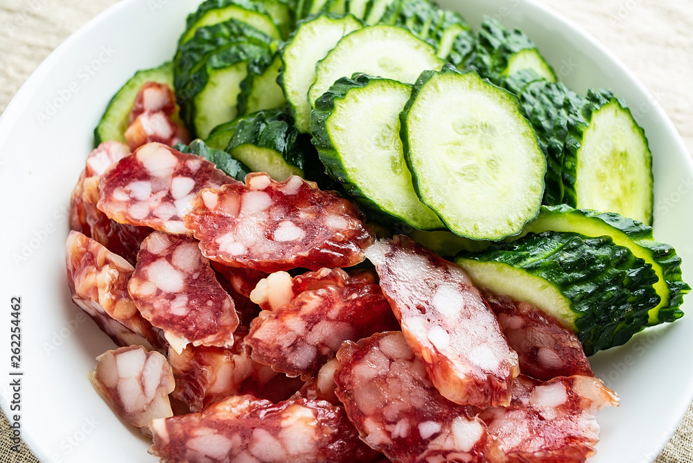 Chopped cucumber slices and sausage Chopped cucumber slices and sausage