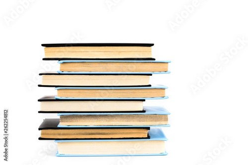 Stack of black and blue books isolated on white