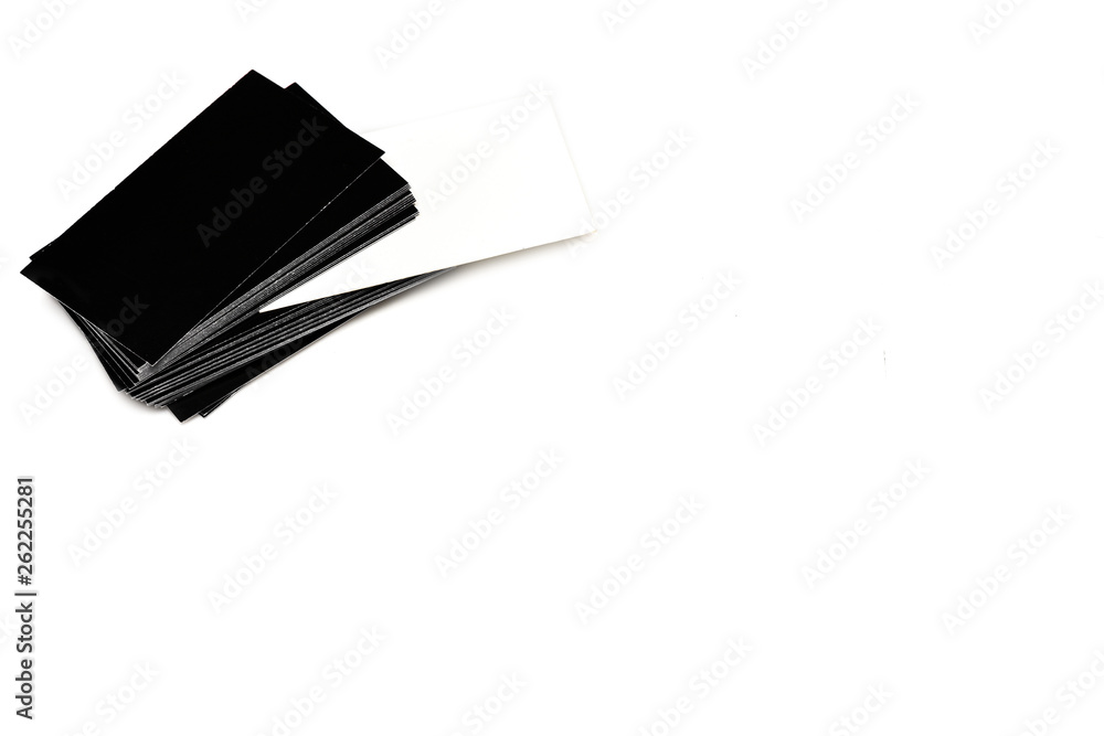 Stack of empty black and white business cards on white Stack of empty black and white business cards on white