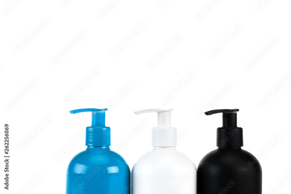 Fototapeta premium Three cosmetic bottles with sprays isolated on white