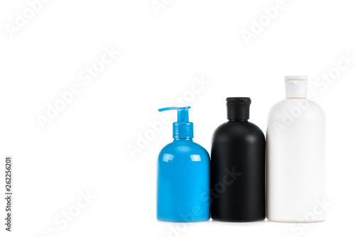 Three cosmetic bottles with spray isolated on white