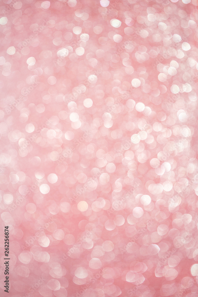Blurred bokeh light red pink coral background, Christmas and New Year holidays background. Party concept. Festive holiday card bright backdrop. Defocused. Flat lay, top view, copy space.