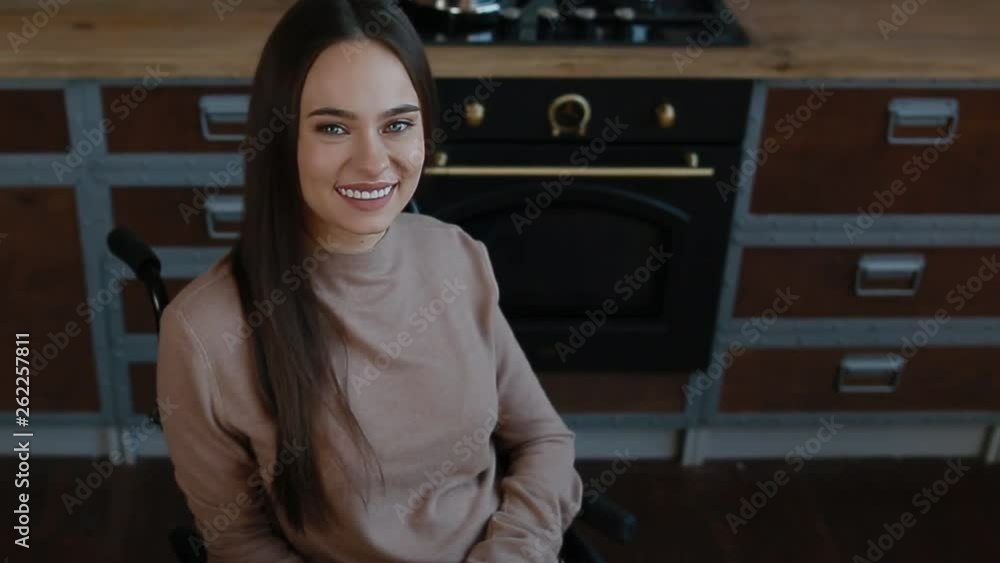 Portrait of beautiful disbled woman on the kitchen Portrait of beautiful disbled woman on the kitchen