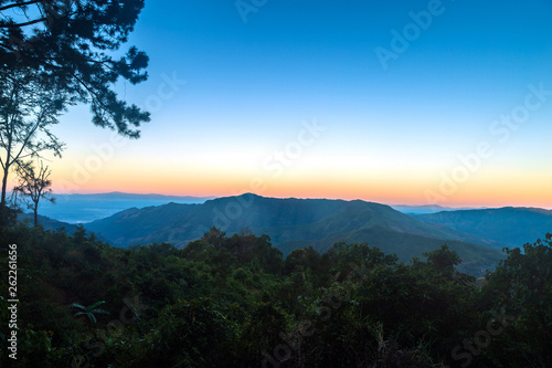 Beautiful landscape of mountain and forest with twilight sky.