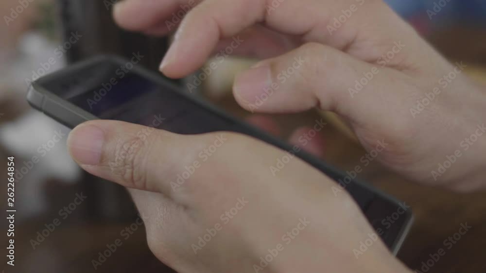 Close-up shot of man hands with smartphone . Technology, Hands of a young man flipping through the news on the smartphone. Close-up shot of man hands with smartphone . Technology, Hands of a young man flipping through the news on the smartphone.