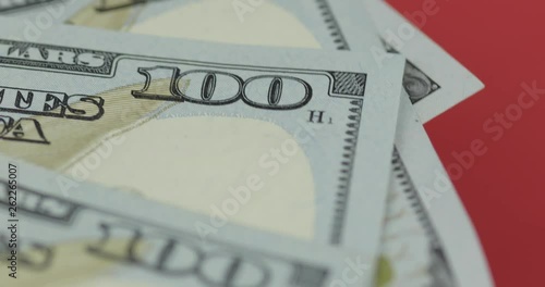 Hundred american dollar bills spinning. Close-up. Background with dollar bills