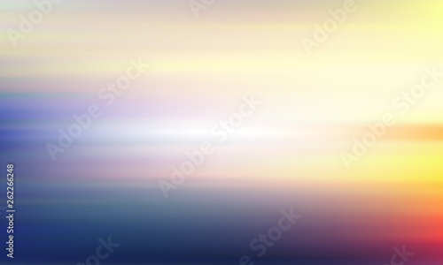 Blurred yellow-blue background. Light sky and sea landscape.