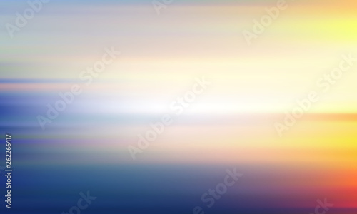 Blurred yellow-blue background. Light sky and sea landscape.