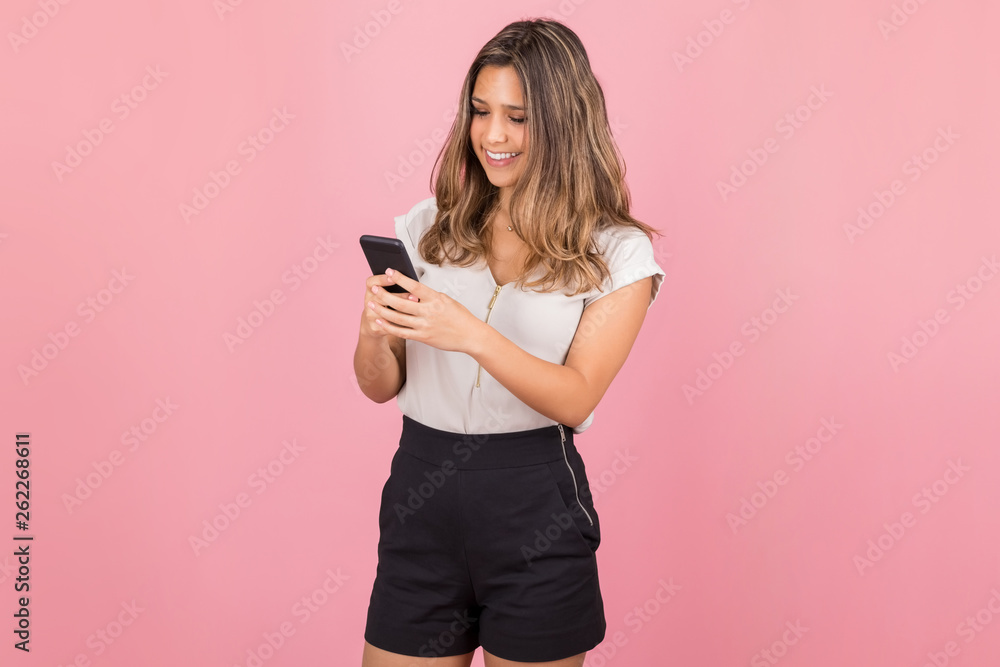 Woman Checking News Feed On Social Network Via Smartphone Woman Checking News Feed On Social Network Via Smartphone