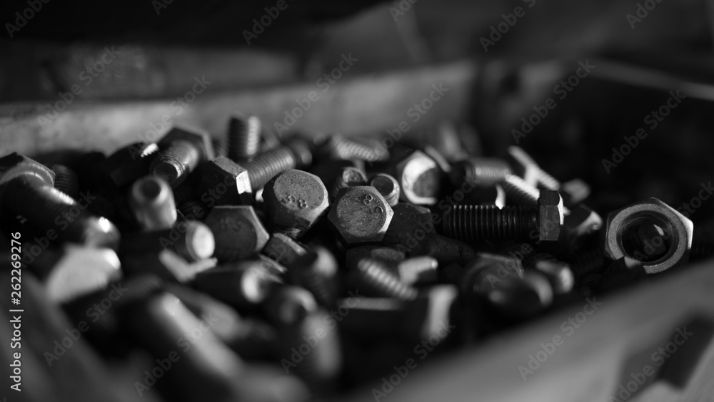 Close up of steel nuts and bolts in tool box Close up of steel nuts and bolts in tool box