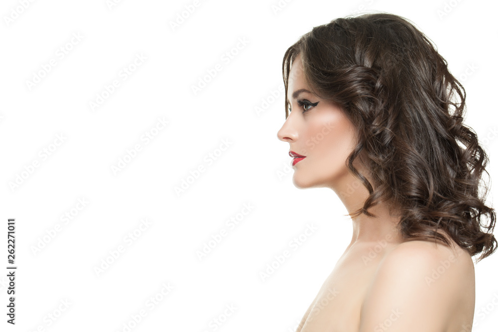 Young woman face isolated. Brunette model profile with makeup and curly hairstyle isolated on white background Young woman face isolated. Brunette model profile with makeup and curly hairstyle isolated on white background