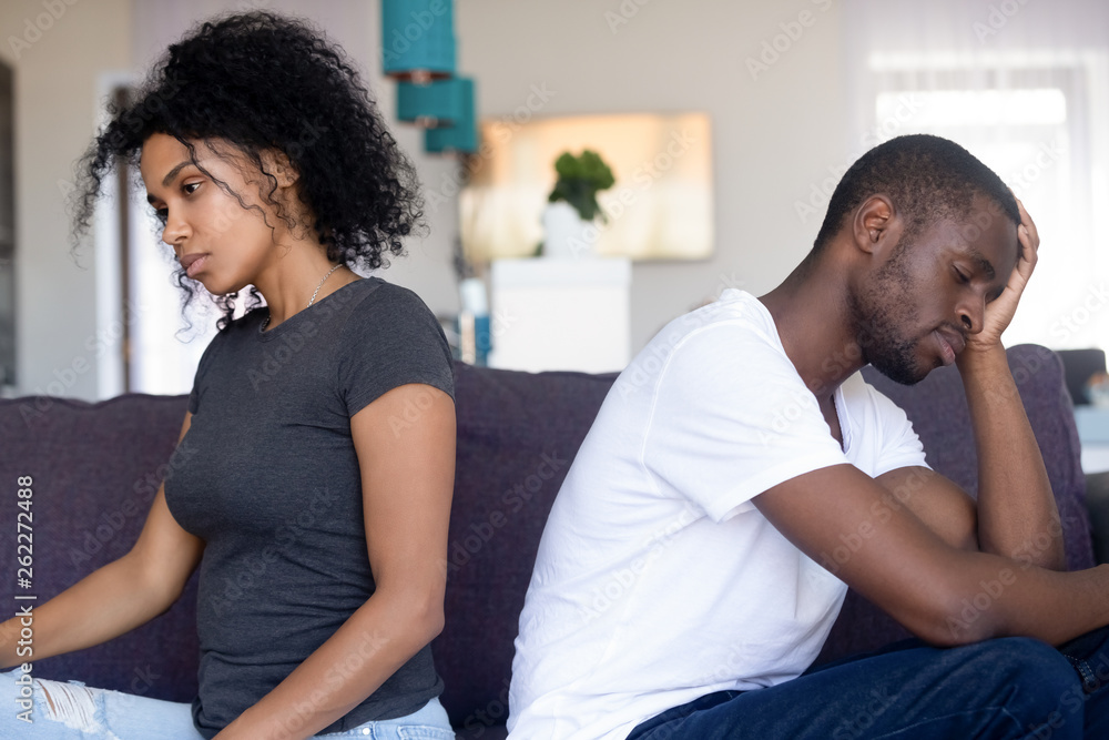 Upset African American couple ignore each other after quarrel - obrazy, fototapety, plakaty 