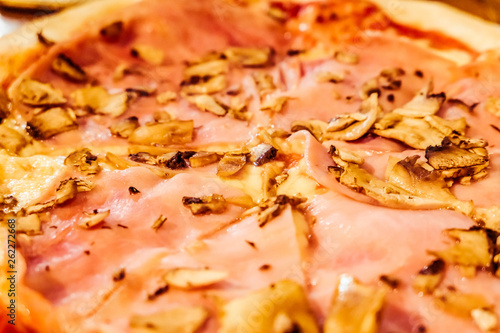 Фотография Traditional Italian pizza in pizzeria in Italy, gastronomic travel experience